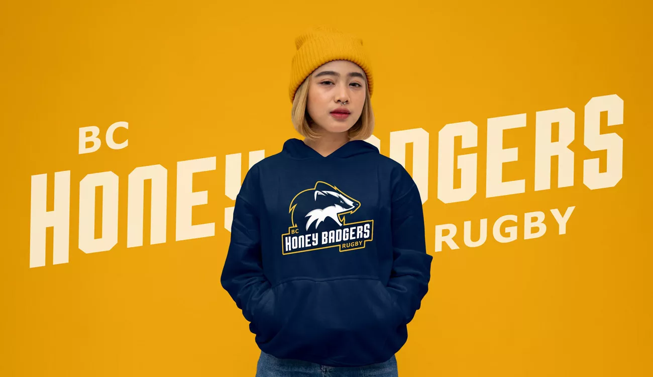 woman wearing a blue hoodie and yellow hat