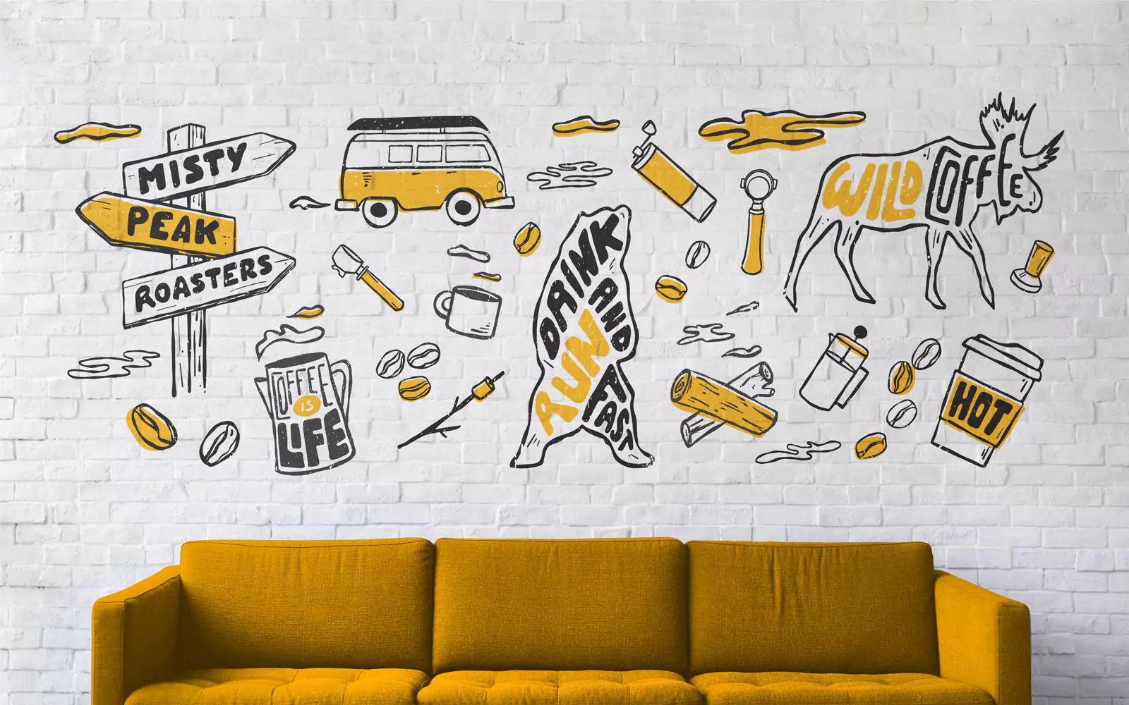 wall of illustrations and orange sofa